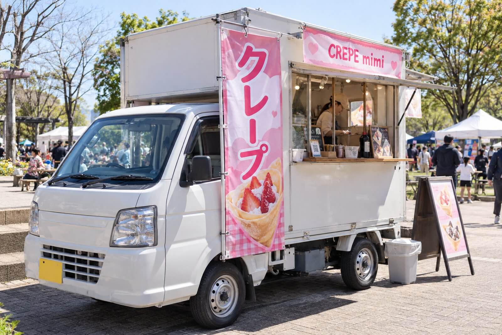 軽トラックベースのクレープのキッチンカーに縦型の幕を設置したイメージ